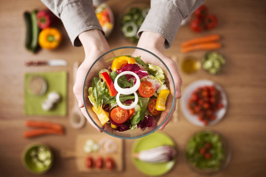39375809 - hands holding an healthy fresh vegetarian salad in a bowl, fresh raw vegetables